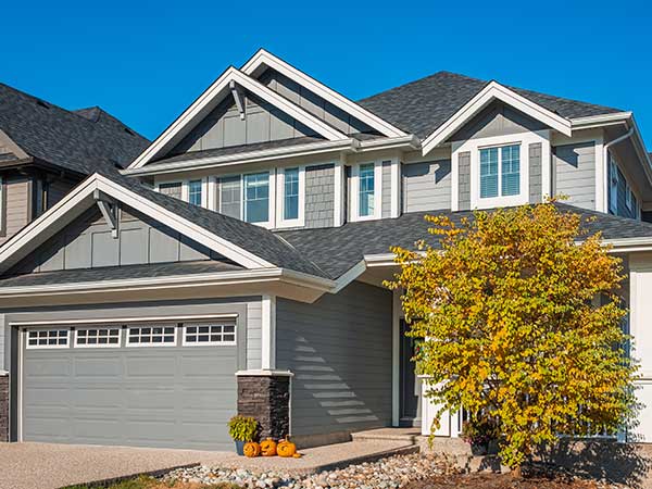 Front of a home with light gray, slightly green siding